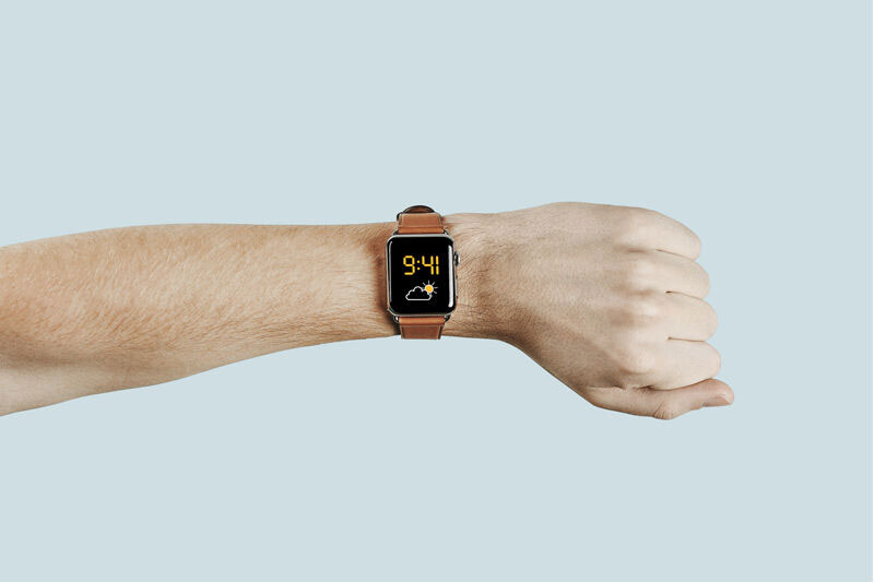 A Hand Wearing an Apple Watch Mockup