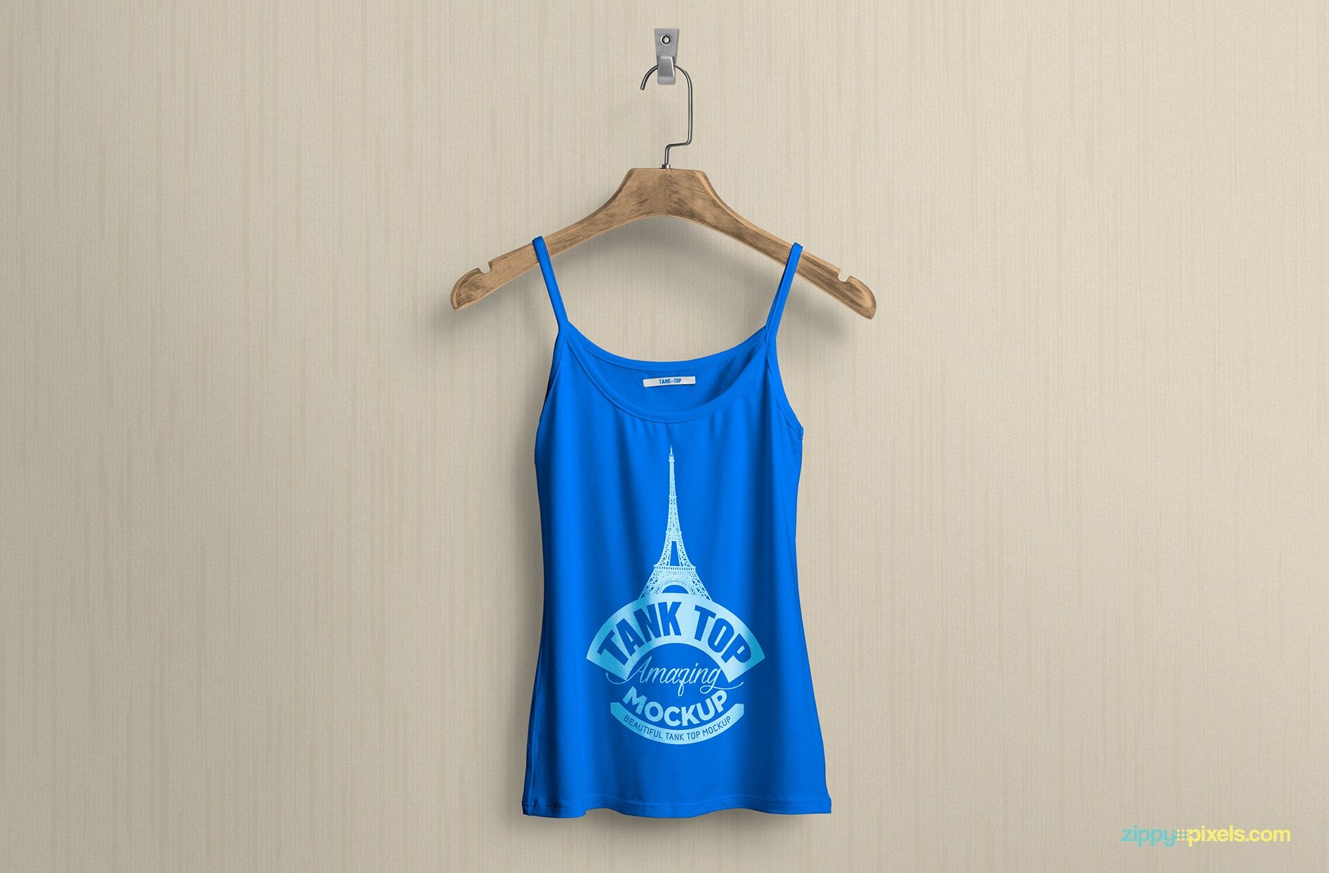 Mockup Displaying Women Tank Top on a Hanger Attached to Wall