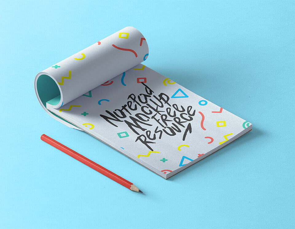 Partly Rolled Notepad Mockup with a Pen