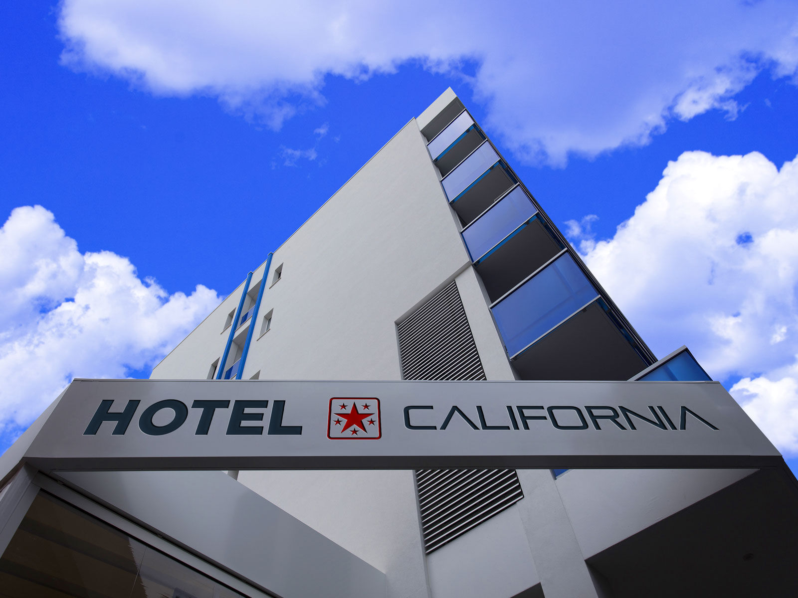 Mockup Showing Low Angle View of Hotel Fascia Board Logo