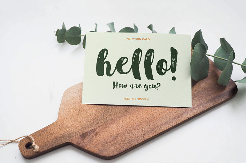 Invitation Card Laid on a Wooden Board Mockup