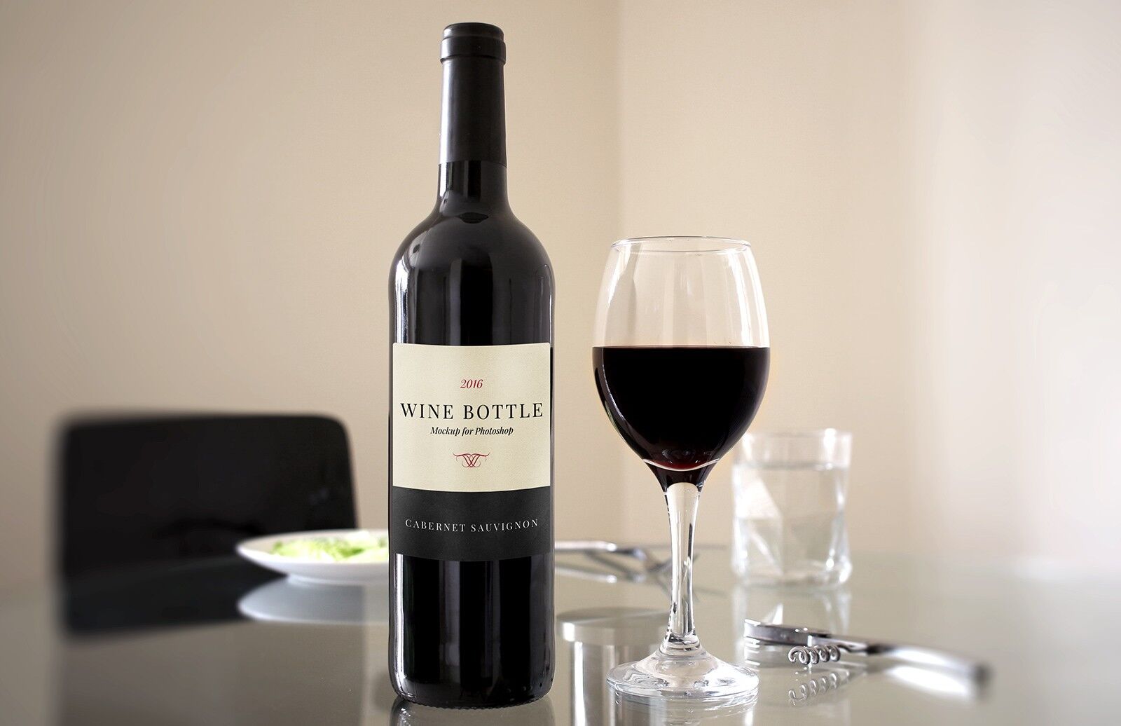 Mockup Showcasing Red Wine Bottle and Glass on a Dinner Table Scene
