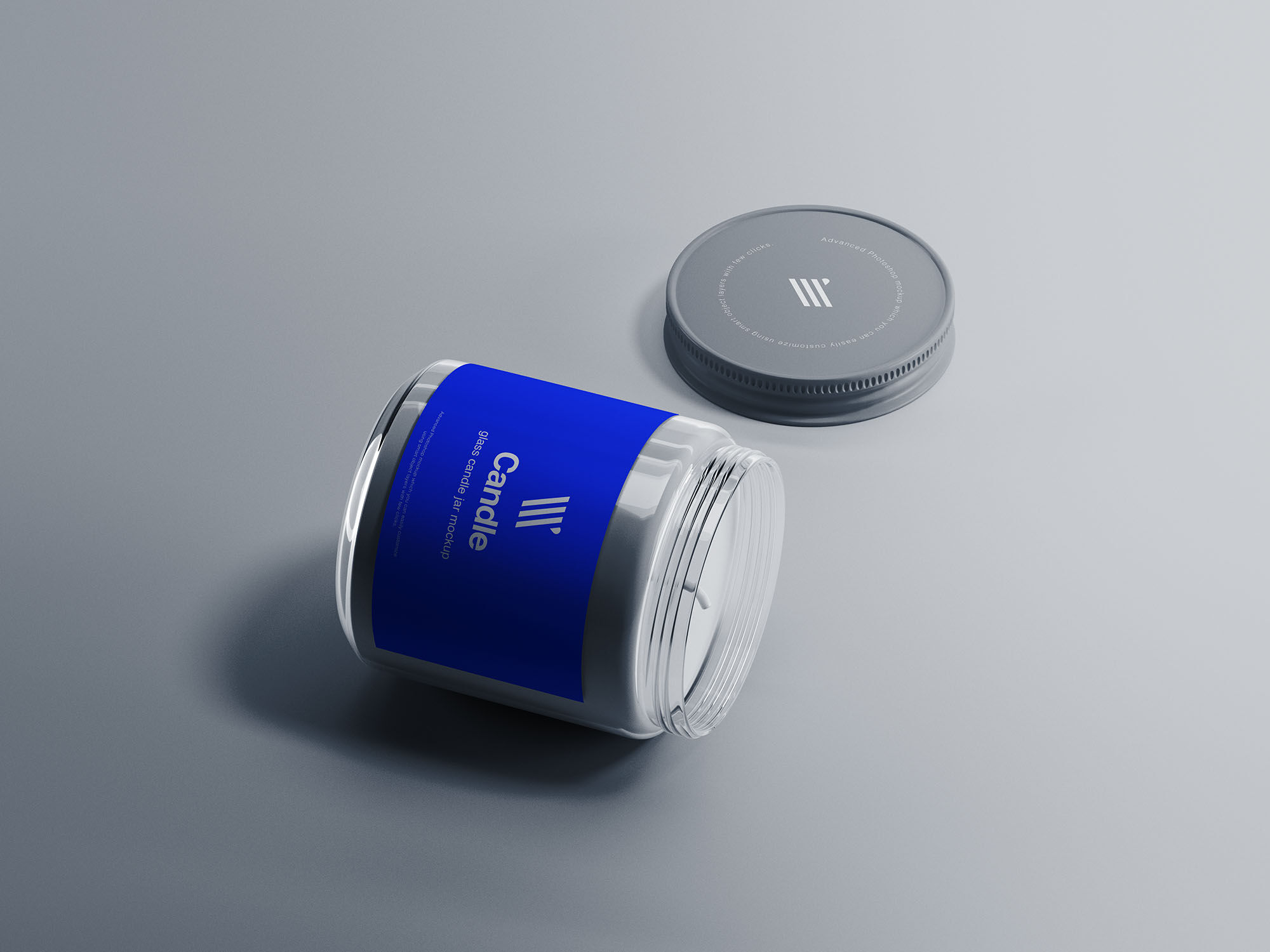 Mockup Featuring a Lying Glass Candle Jar and Its Cap on a Flat Surface