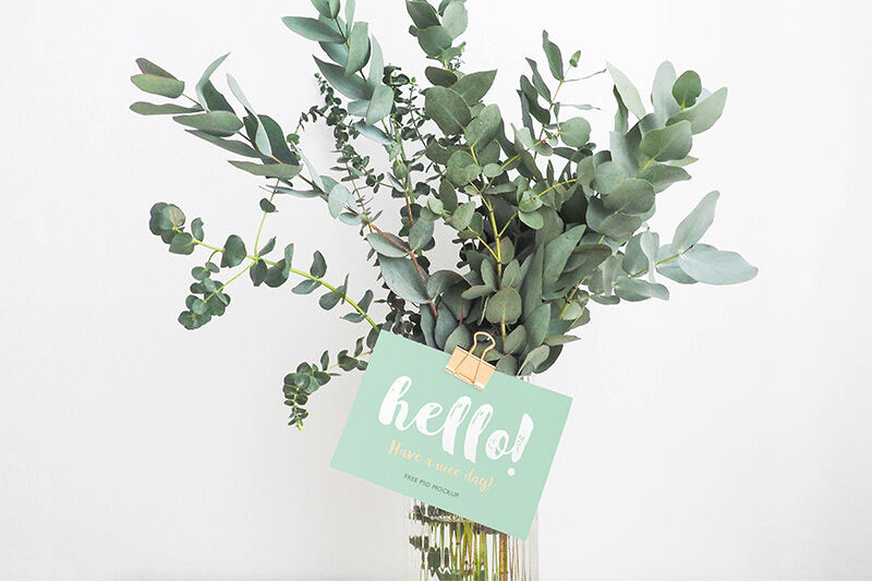 Plain and Realistic Gift Card Mockup Stick to a Flower