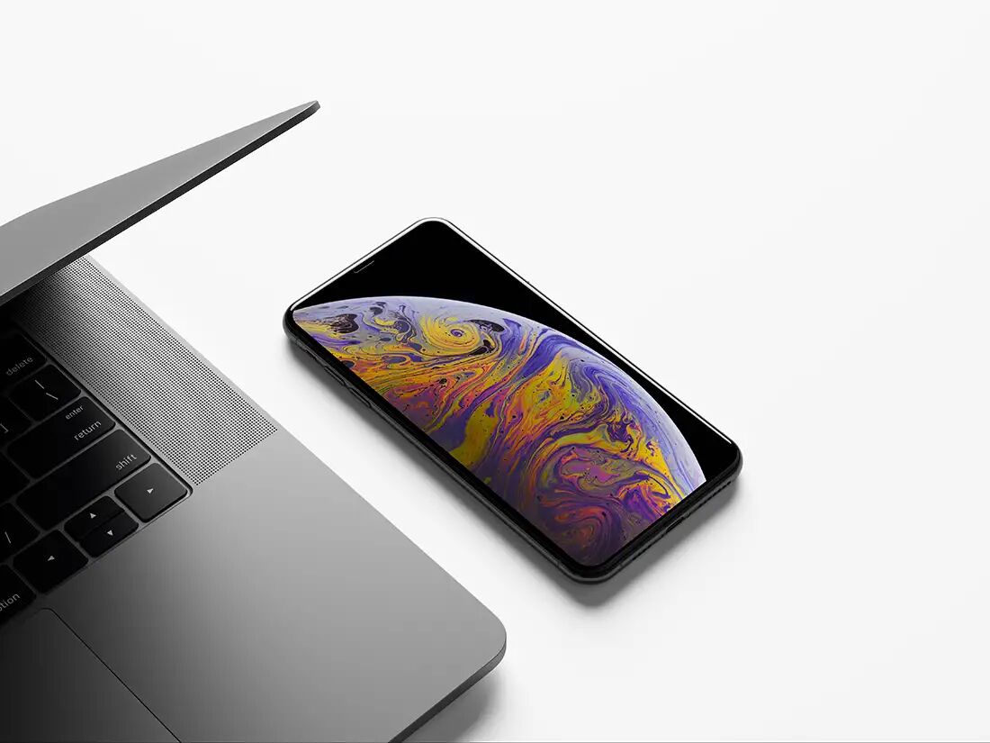Realistic iPhone XS Max Mockup next to a MacBook preview