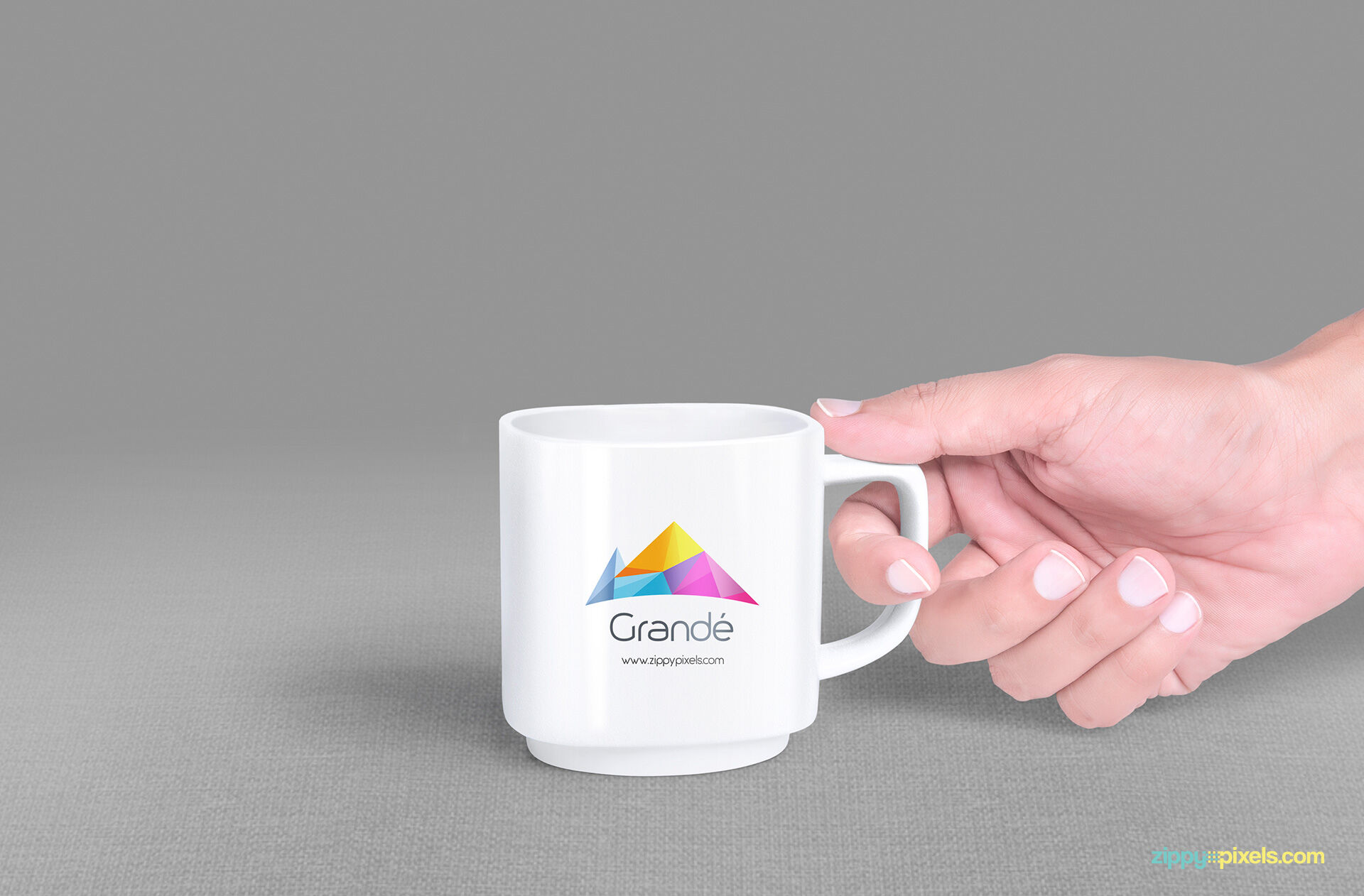 Guy’s Hand Holding a Mug Mockup