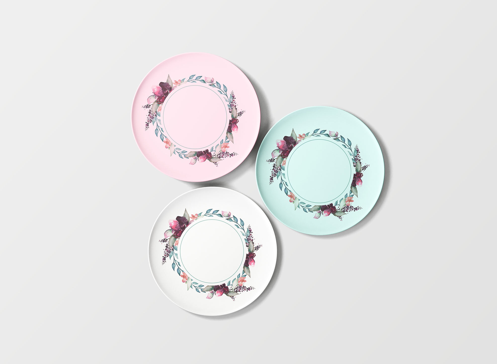 Overhead View of Three Round Floral Plates Mockup preview