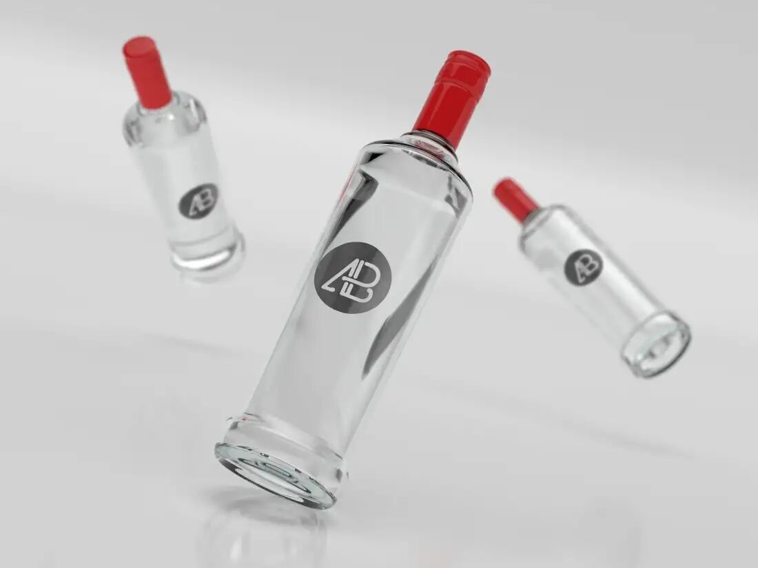 Three Floating Vodka Bottles Wearing Red Caps Mockup