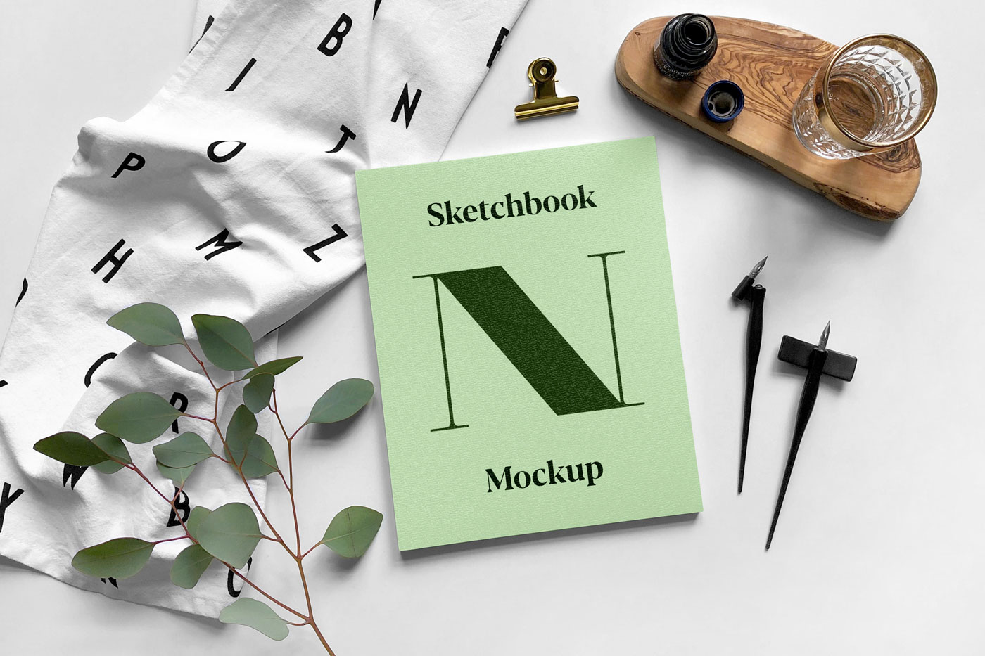 Mockup Showcasing a Top View of a Simple Sketchbook