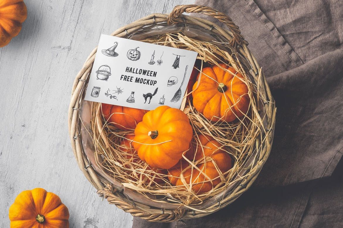 Mockup Showing Halloween Card on a Basket Filled with Tiny Pumpkins