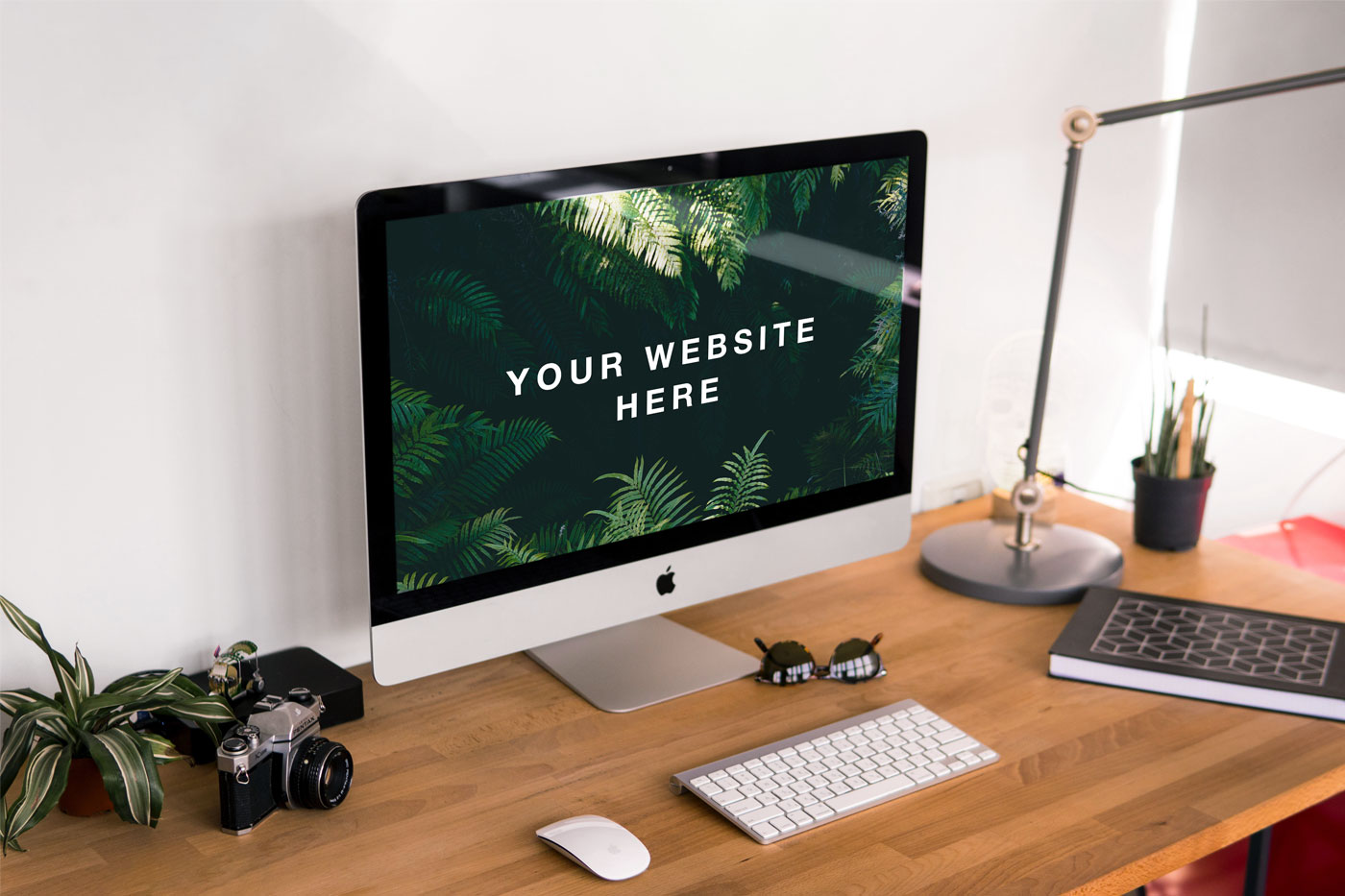 3/4 View of an iMac on a Wooden Desk