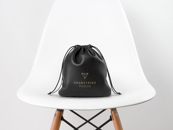 Leather Drawstring Pouch Placed on a White Chair Mockup preview
