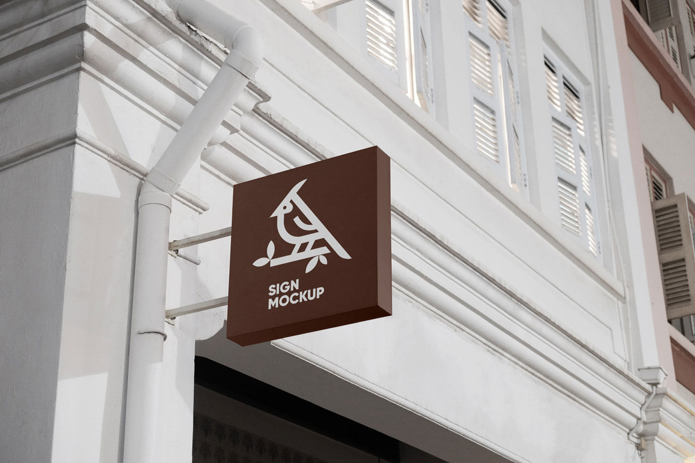 Mockup Featuring a Wall-Mounted Sign