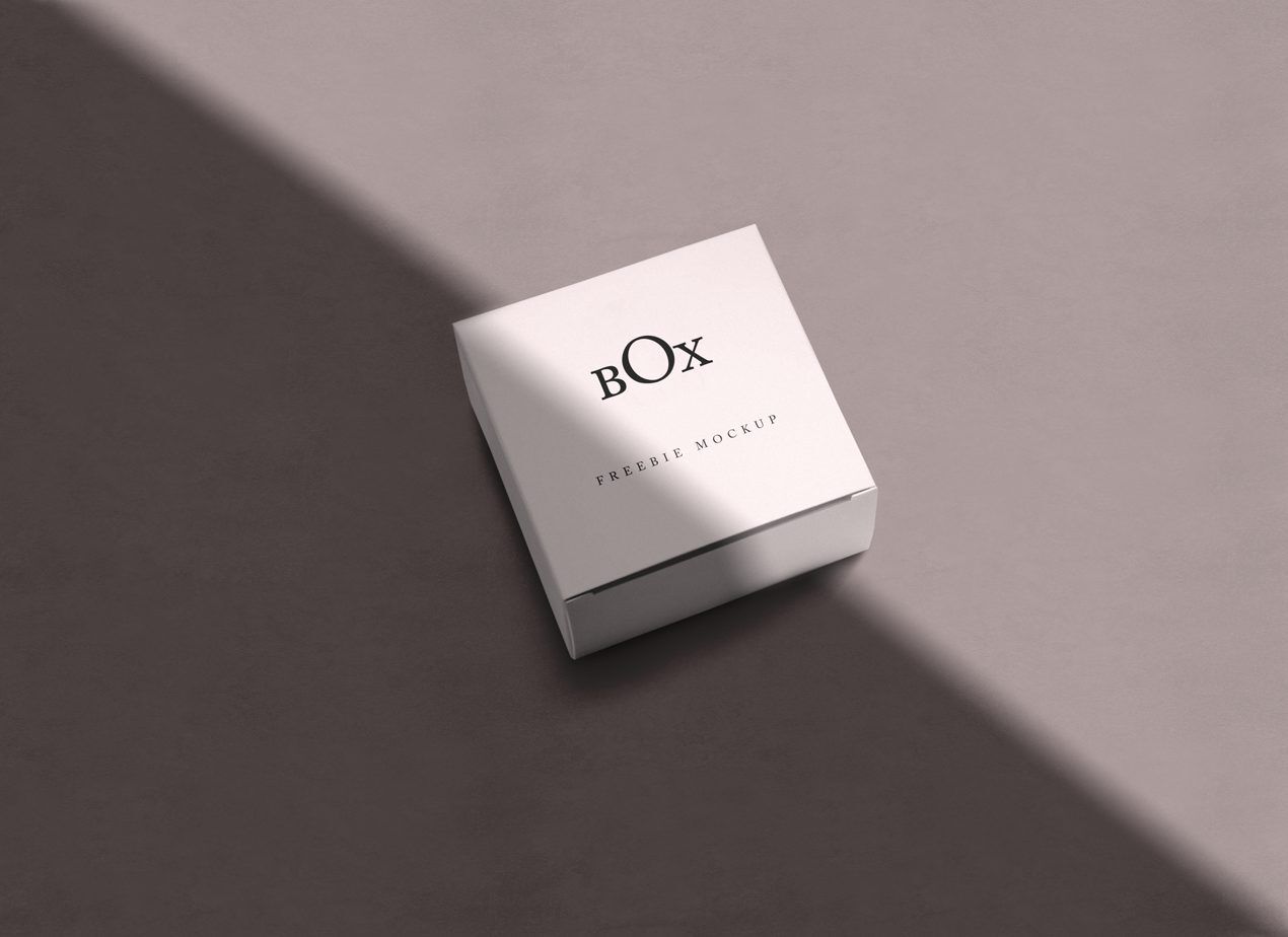 Mockup Showcasing Square Box in Four Different Scenes with Overlayed Shadows
