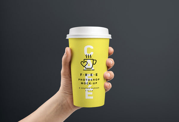 Hand Holding Coffee Cups in Two Sizes Mockup