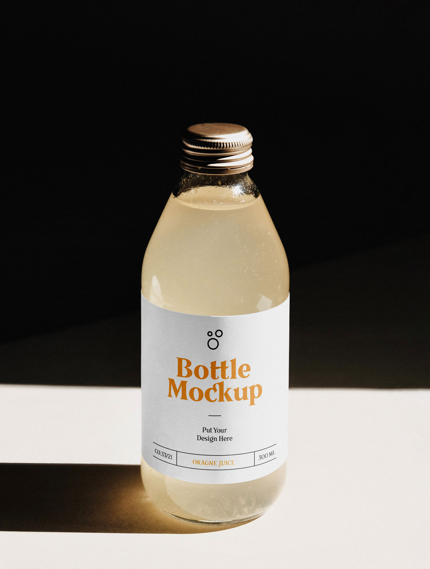 Realistic Glass Bottle Mockup with a Dark Background