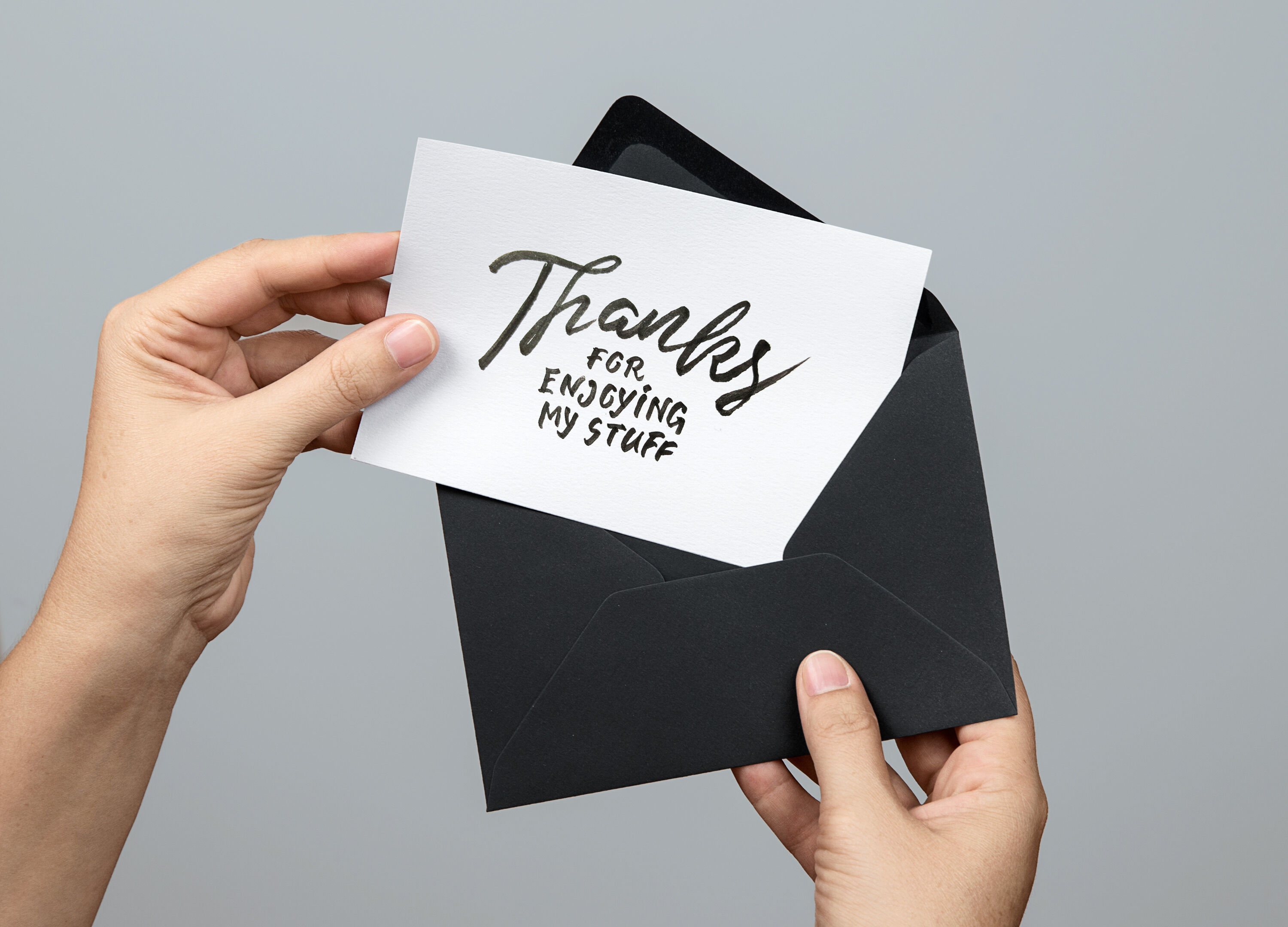 Woman Holding a Greeting Card Mockup
