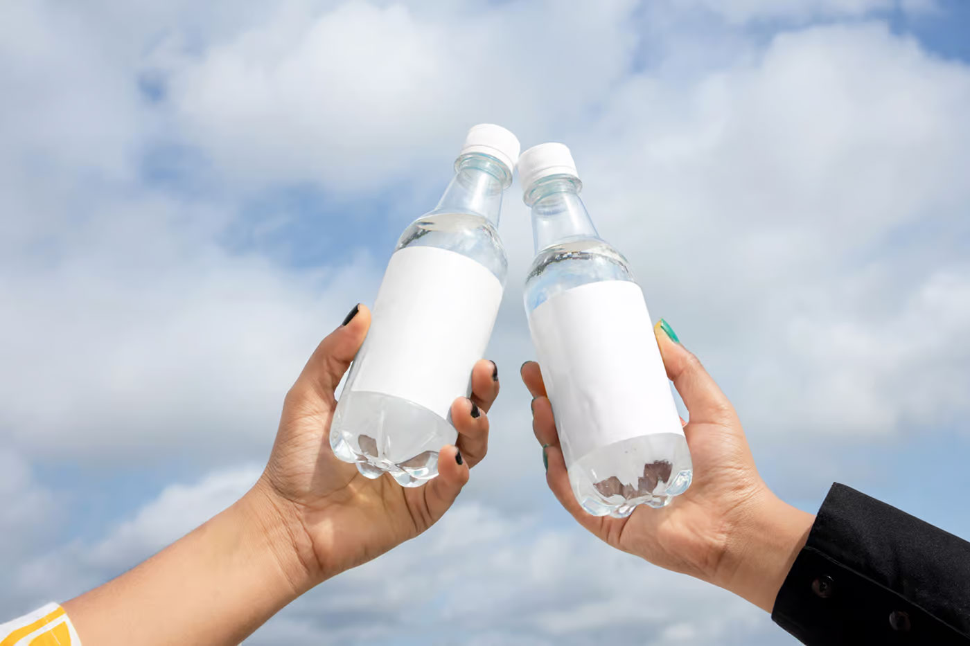 Two Bottle in Hand Mockups