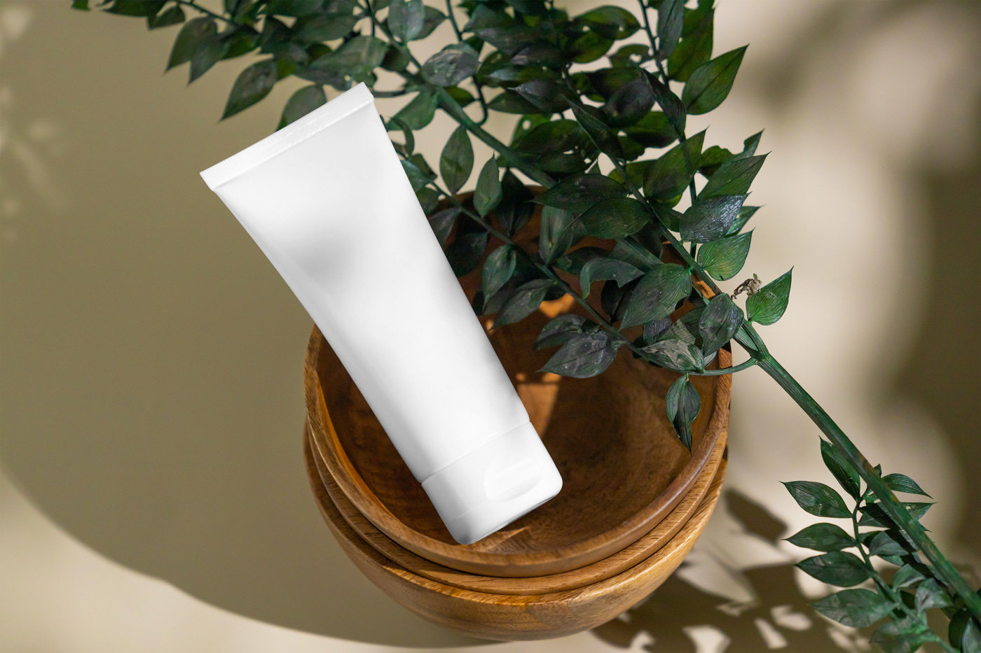 Top View of Cosmetic Tube Mockup on Wooden Bowl preview