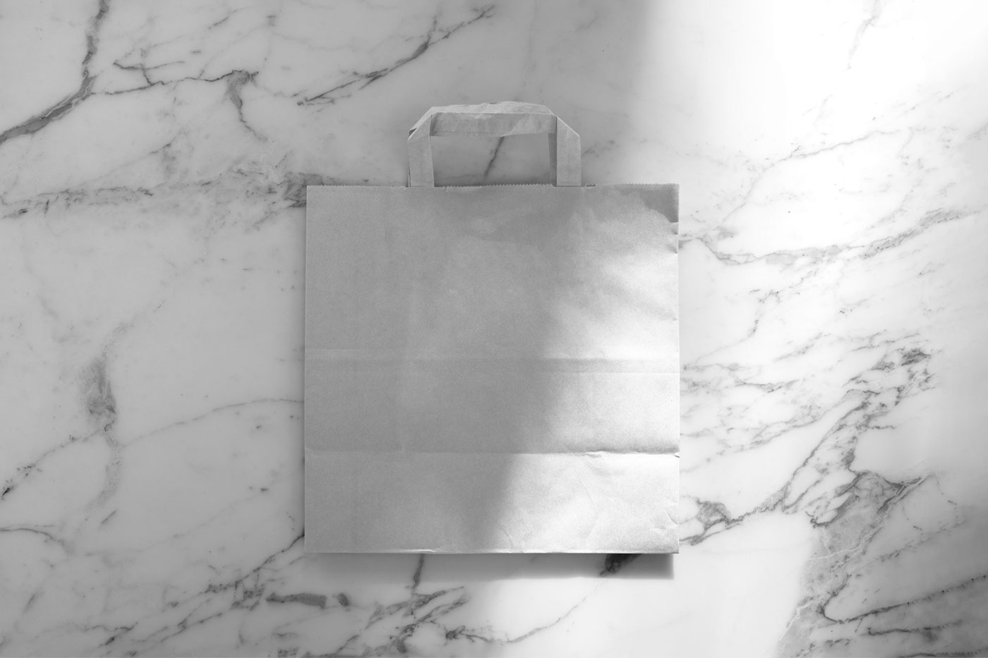 Top View of Paper Shopping Bag Mockup on Marble preview