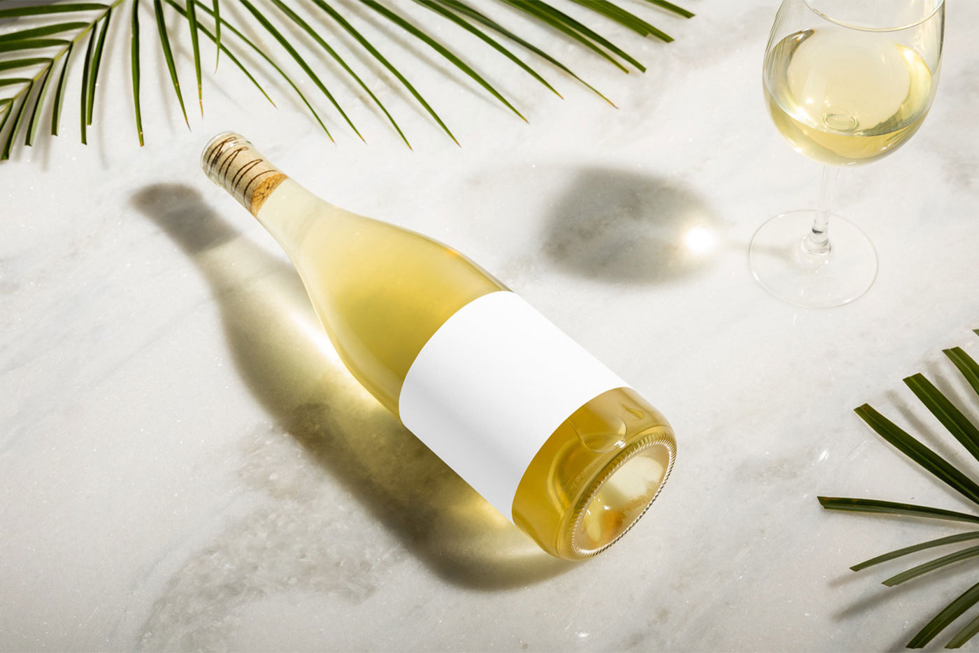 Top View of a Champagne Bottle Mockup with a Glass
