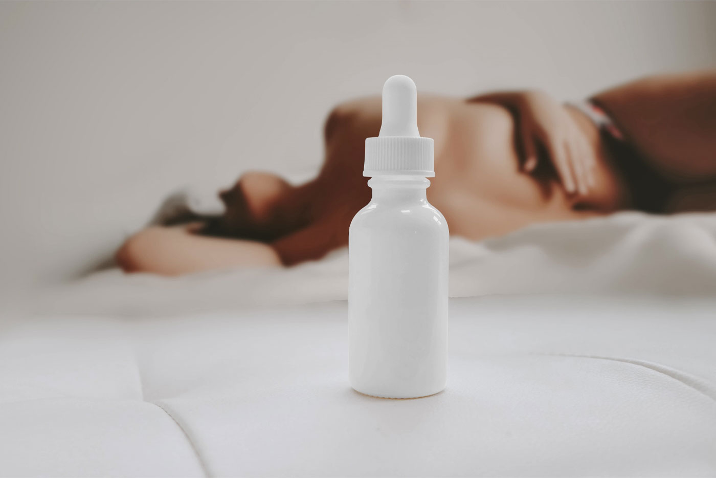Front View of Bottle Dropper Mockup with Woman preview