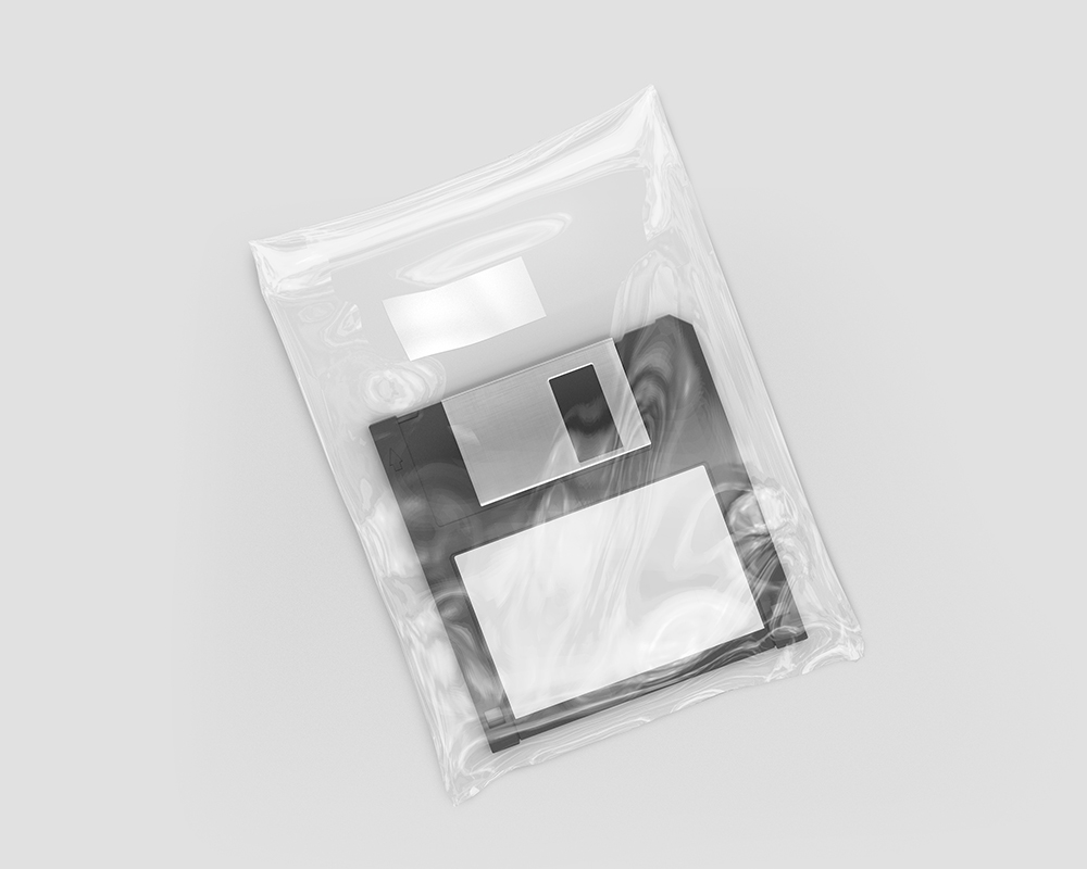Top View of a Floppy Disk in a Clear Plastic Wrap Mockup