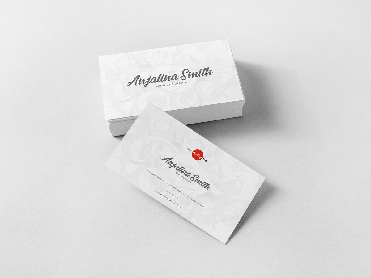 Set of Business Cards with One Leaning Against Them Mockup preview