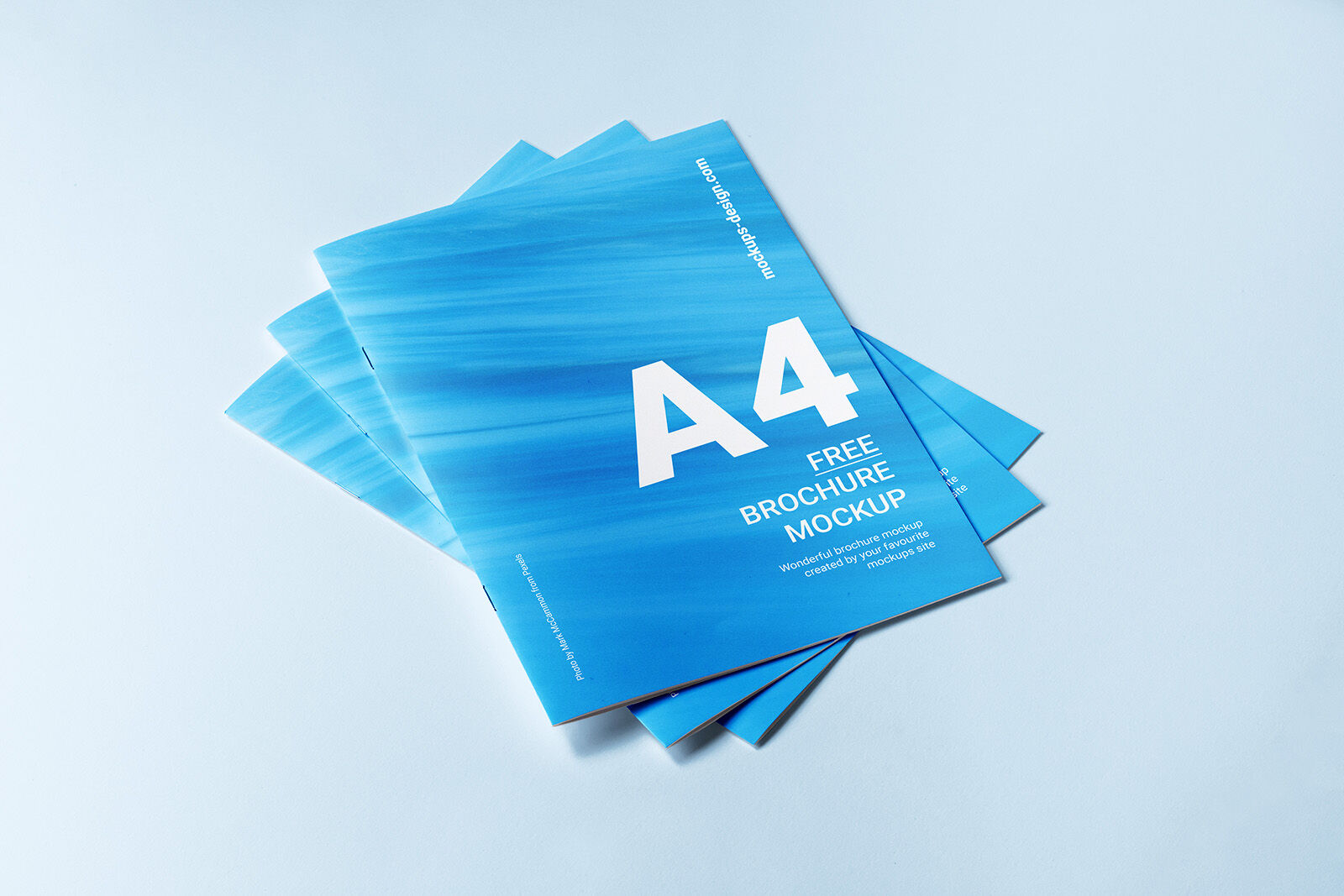3 Mockups Including 3 Closed A4 Brochures in Different Positions preview