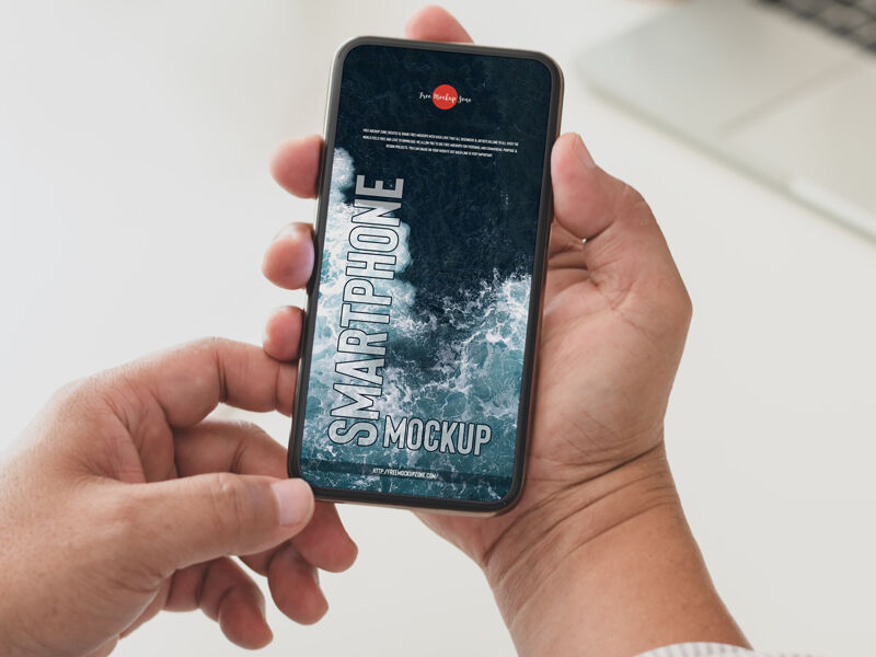 Top View of Hand Holding Smartphone Mockup preview