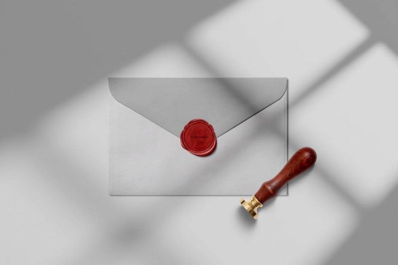 Mockup of the Wax Seal Stamp Along with an Envelope in Top View