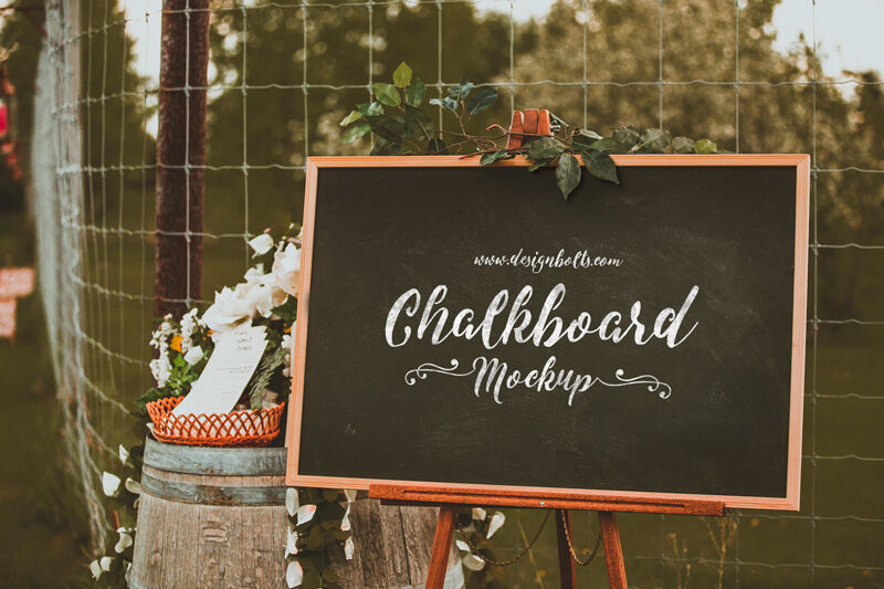 3/4 View Chalkboard in Outdoor Setting Mockup with Flowers preview