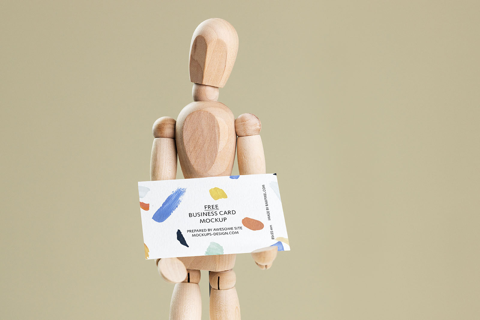 Business Card Held in Hands of a Wooden Manikin Mockup preview