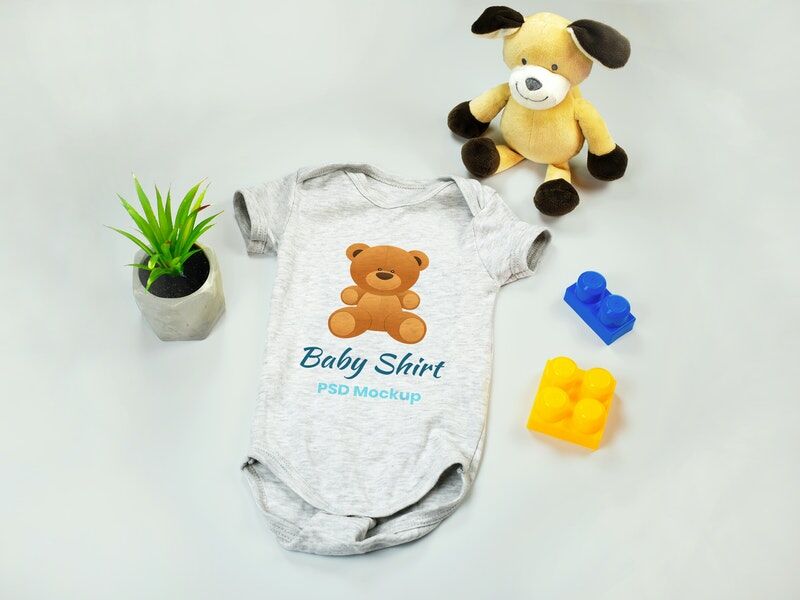 Mockup of Baby Onesie with Teddy Bear and Blocks toys preview