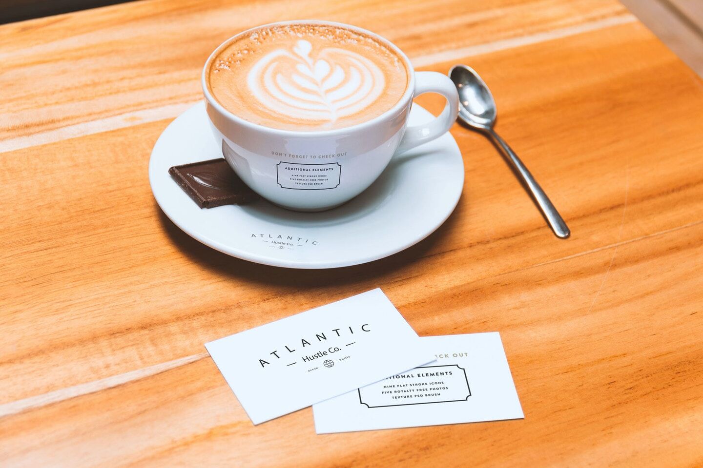 Mockup Showing Two Business Cards and Coffee Cup on Saucer preview