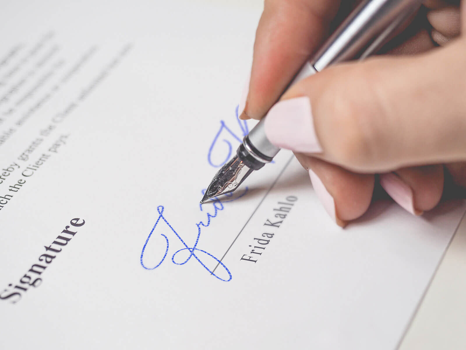 Signature Mockup of a Female Hand Holding a Fountain Pen preview