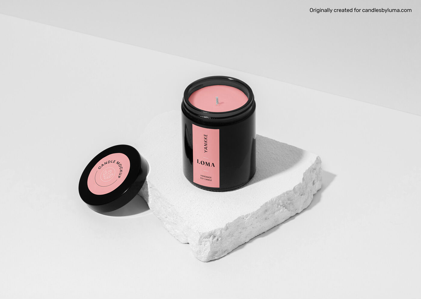 Mockup of a Candle Placed on a Piece of Stone