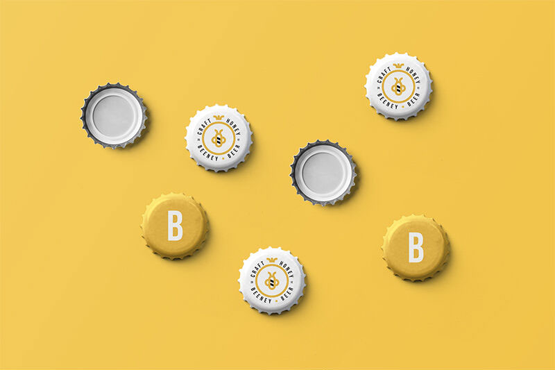 Overhead View of Realistic Beer Cap Mockups