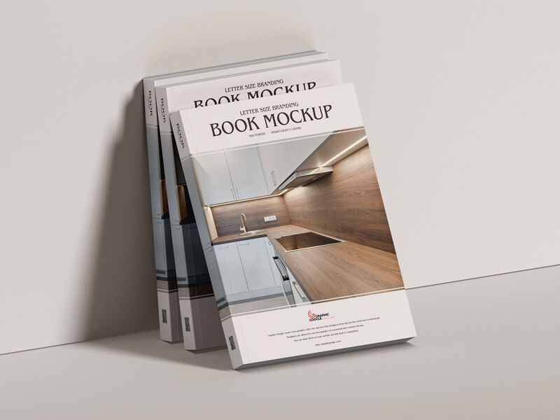 Mockup of Three Branding Books Leaning Against the Wall in Half-Side View preview